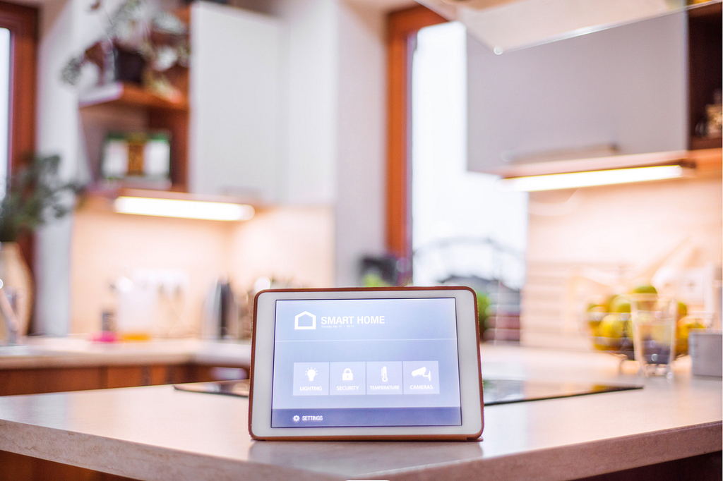smart home system on tablet with smart roller blinds